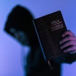 Person Holding Bible