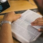 Close-Up Shot of a Person Reading a Bible