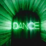 brown door with Dance neon lights