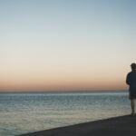 man standing near sea