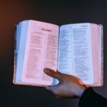 Person Holding A Bible