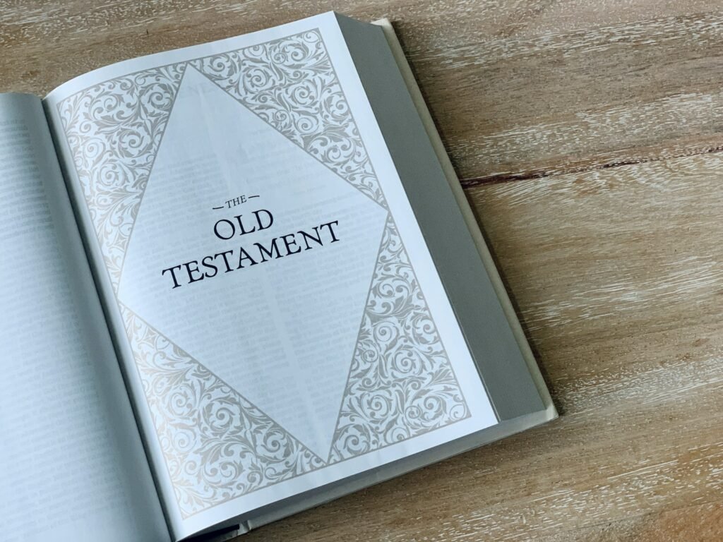 an open book with the words old testament on it - the third hour in the bible