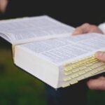 a person holding a book in their hands