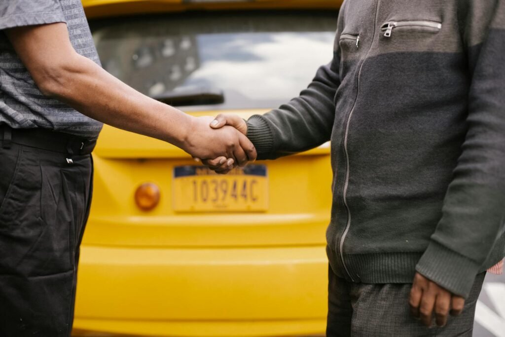 Side view of crop ethnic anonymous males shaking hands while meeting each other on street - what does the bible say about respect