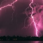 a purple sky filled with lots of lightning