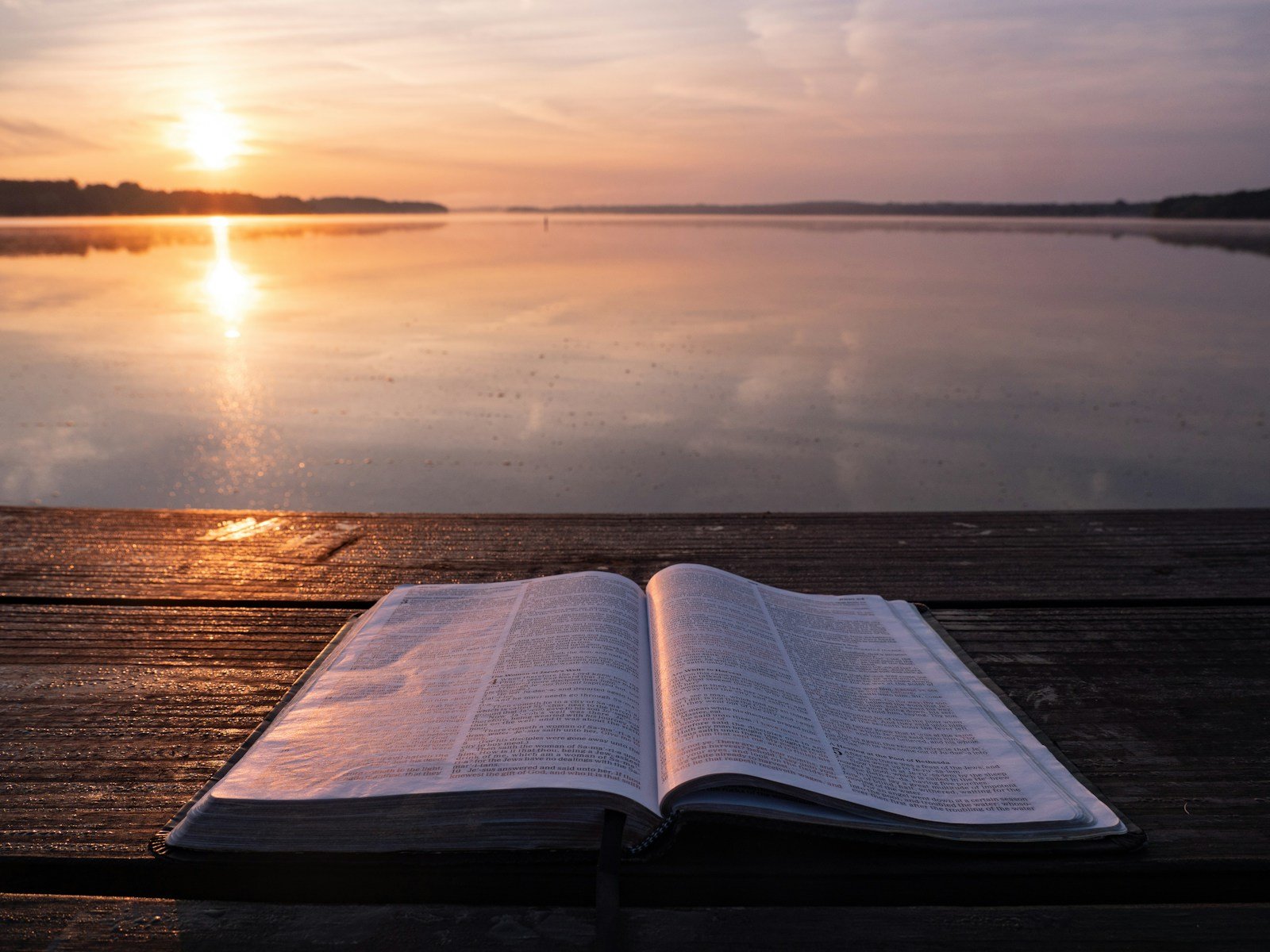 book on top of table and body of water - what does the bible say about end times