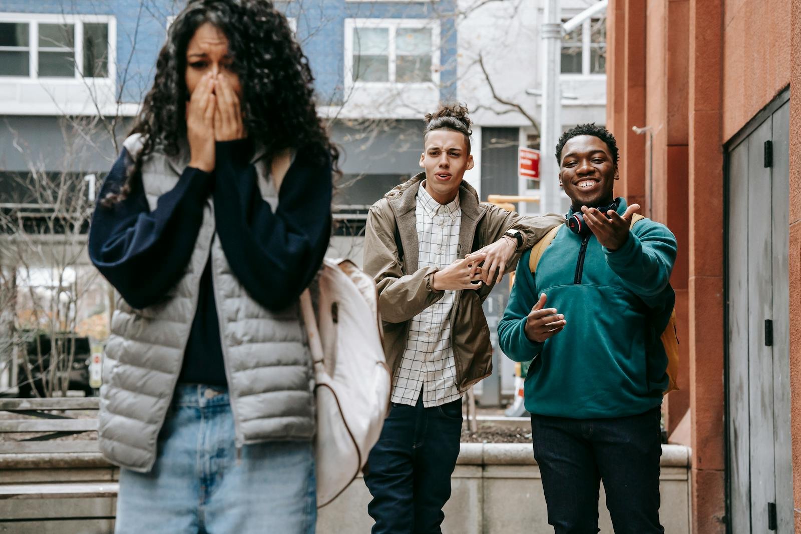 Young diverse men harassing female on street - what does the bible say about liars