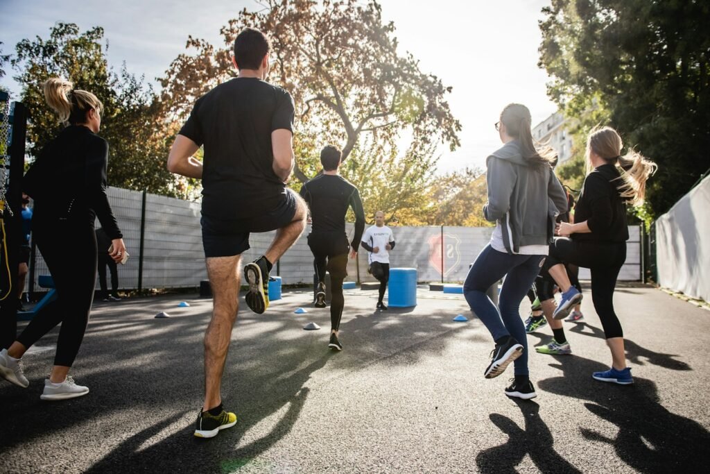 man in black t-shirt and black shorts running on road during daytime - what does the bible say about exercise