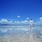 woman wearing white shirt walking on water during daytime - what does the bible say about free will