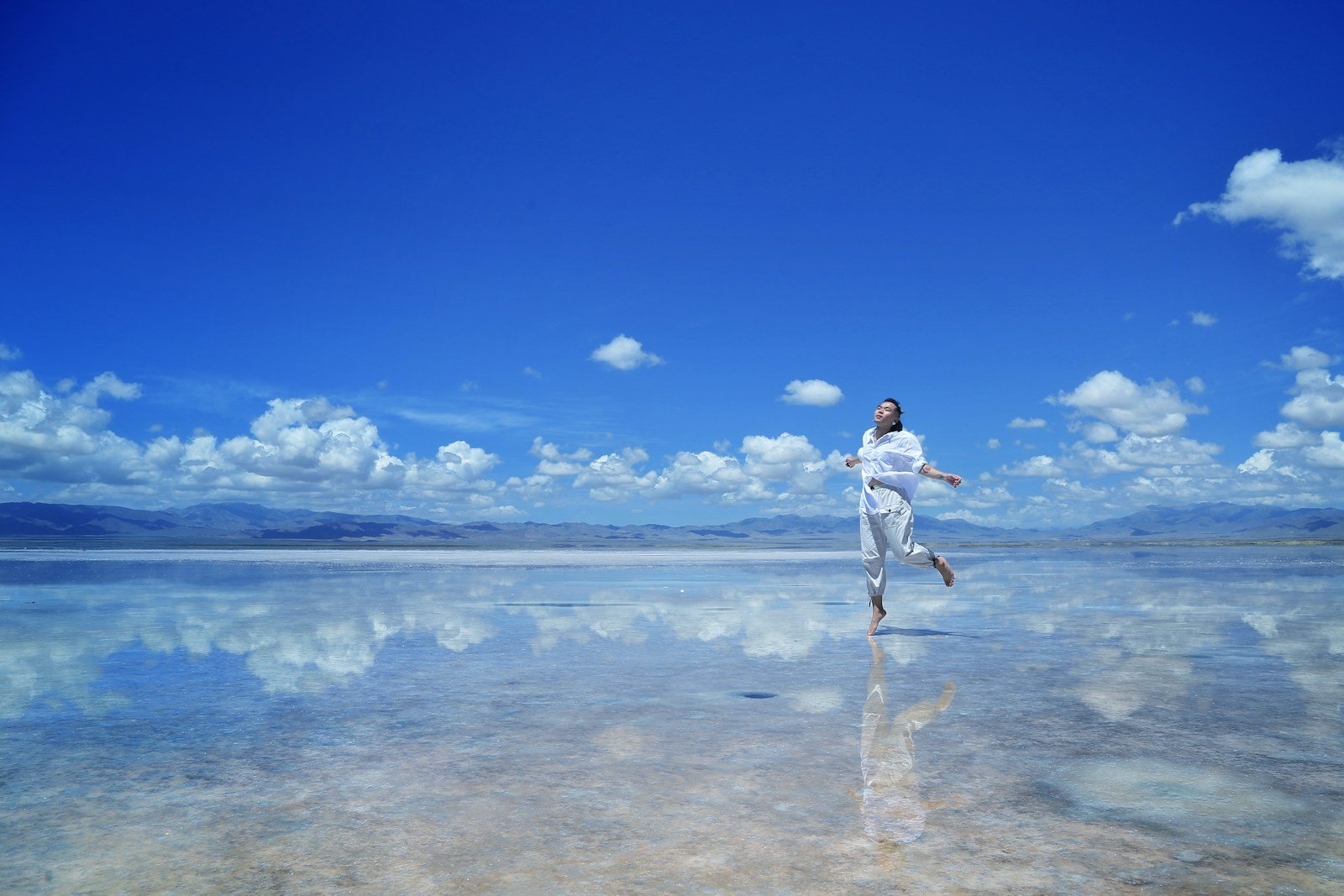 woman wearing white shirt walking on water during daytime - what does the bible say about free will