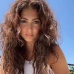 a woman with long brown hair - is tori kelly a christian