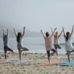 five woman standing on seashore - Can Christians Practice Yoga?